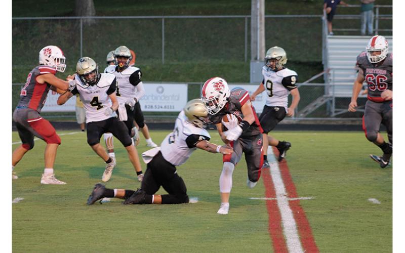 Press Photo/Will Woolever - Senior wide receiver/defensive back Grant Adams attempts to shed a tackle against Hayesville Aug. 27. Adams was named this week’s Wayah Insurance Player of the Game after catching the game-winning interception against Swain. 