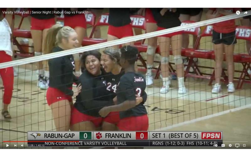 Photo courtesy of Franklin Panther Sports Network - Outside hitter Sydney Williams (#24) celebrates with fellow seniors (from left) Corey Burrell, Bethany Jenkins, and Anya Valentine after recording her first point since tearing her ACL this summer.