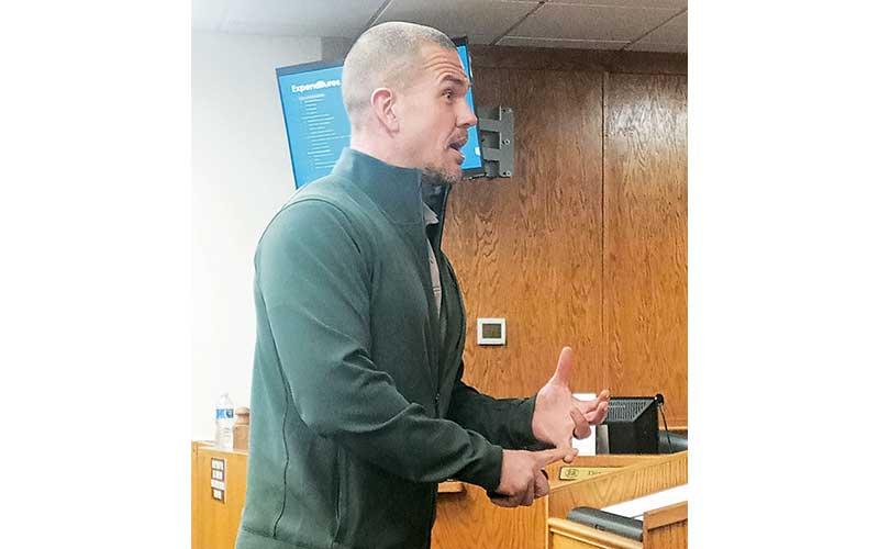 Press photo/Thomas Sherrill - County Manager Derek Roland addresses the Board of Commissioners during the budget kick-off meeting on Feb. 9.
