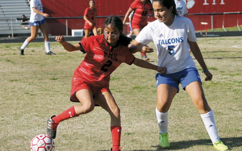 Press photo/Will Woolever - Sophomore defender Briseida Tlahuice tries to shake a West defender at the Panther Pit April 4. 