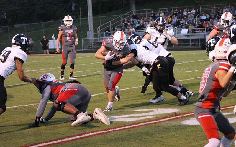Press photo/Will Woolever - Sophomore running back Addix Sutton tries to break a tackle in Franklin’s 31-14 win over Tuscola Sept. 22.