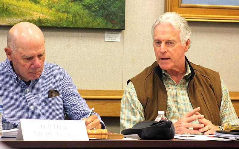Press photo/Thomas Sherrill - Macon County Public Library Board of Trustees member Wood Lovell (right) makes a point to board chair Bill Dyar during the Oct. 3 meeting.