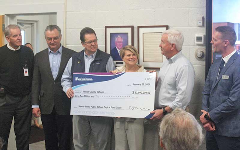 Press photo/Thomas Sherrill - State Superintendent of Public Instruction Catherine Truitt presents Macon County and Macon County Schools with a grant for $62 million to build a new Franklin High School. Pictured from left are County Commissioners Chair Gary Shields, Rep. Karl Gillespie, Sen. Kevin Corbin, School Board Chair Jim Breedlove and Superintendent Josh Lynch.