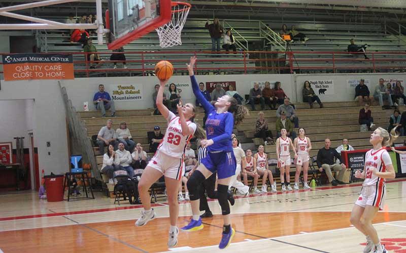 Freshman center/forward Bailey Wooten drives to the rim in Franklin’s conference semifinal versus West Henderson Feb. 15. (Press file photo)